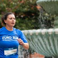 Individual passing by fountain as they finish race